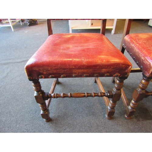 1024 - A set of four 1940's oak framed Cromwellian style dining chairs, studded upholstery