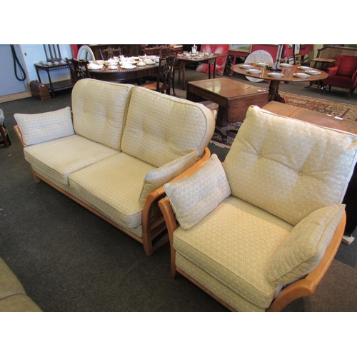 1132 - An Ercol two seater sofa and matching chair