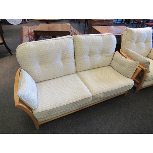 1132 - An Ercol two seater sofa and matching chair