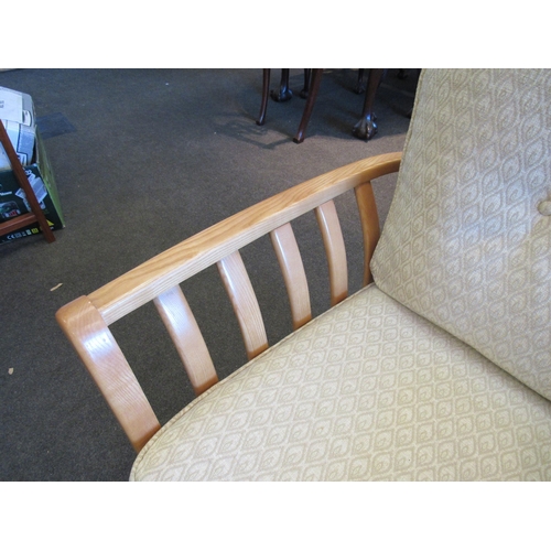 1132 - An Ercol two seater sofa and matching chair