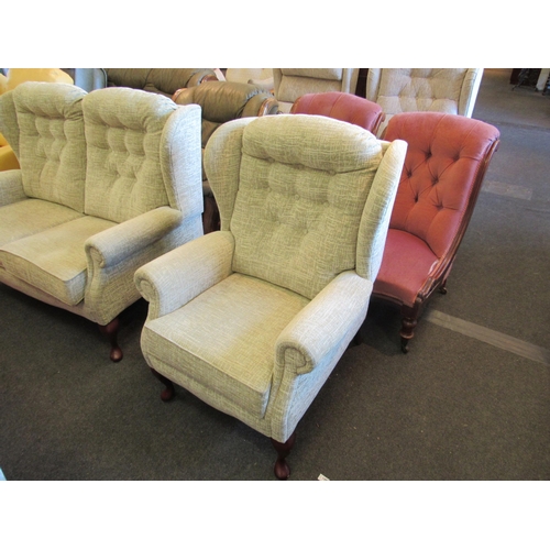 1137 - A modern two seater wingback sofa with button back on cabriole fore legs and a matching armchair    ... 