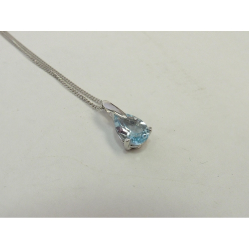 1259 - A 9ct white gold chain hung with an aquamarine pendant, 2g   (C)