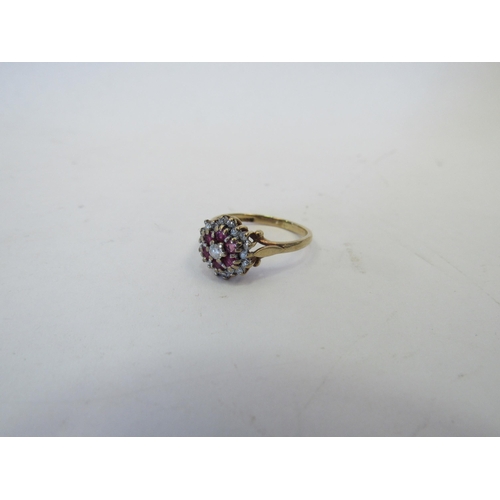 1267 - A 9ct gold, ruby and diamond cluster ring, approximately 1.9g   (C)