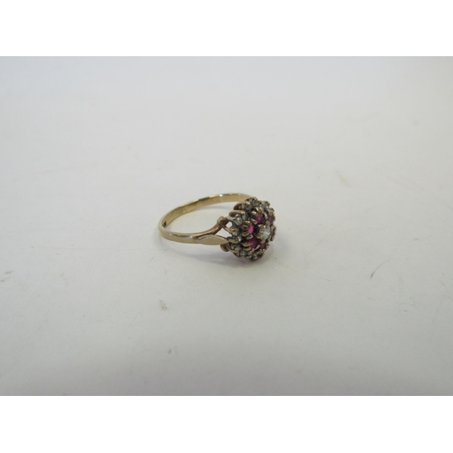 1267 - A 9ct gold, ruby and diamond cluster ring, approximately 1.9g   (C)