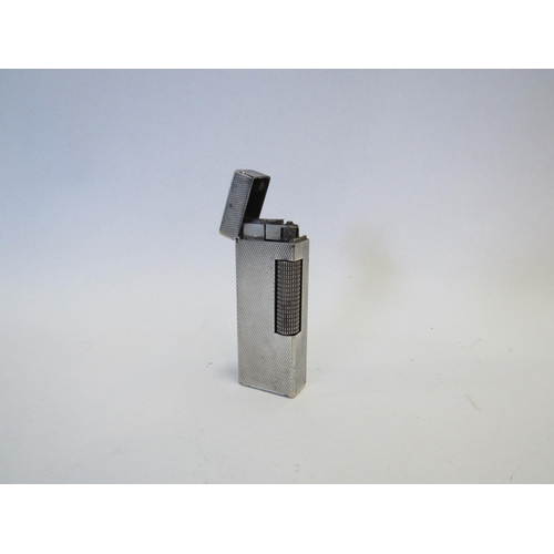 1310 - A Dunhill silver plated lighter