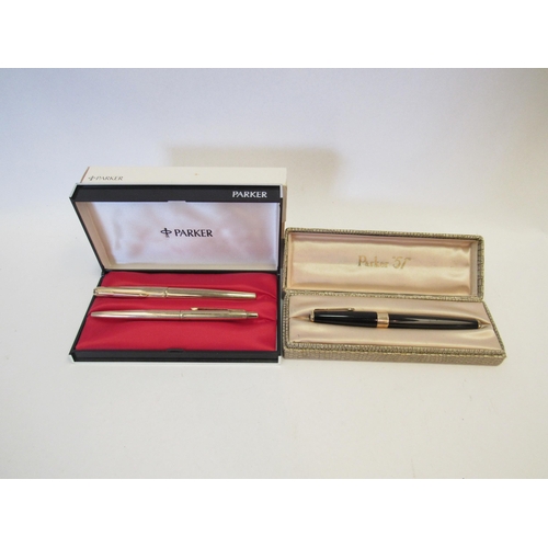 1319A - A cased Parker fountain pen together with another two pen set