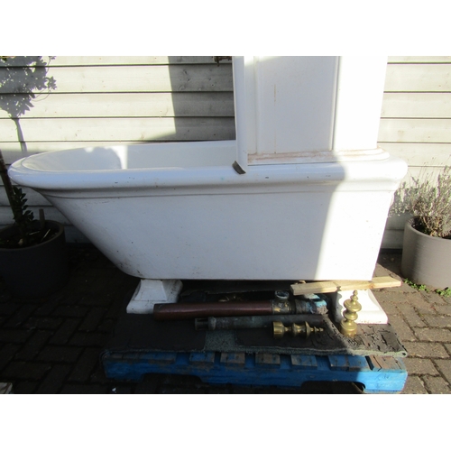 2001 - A late 19th/early 20th Century ceramic roll top bath with enamel shower splash back and brass fixing... 