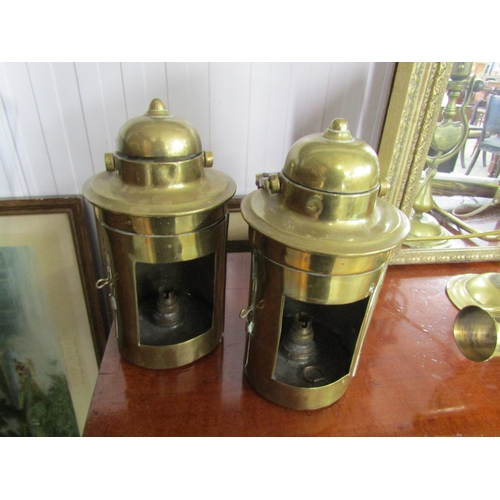 2102 - A pair of brass carriage lights converted to electricity, a brass picture light and a swinging brass... 