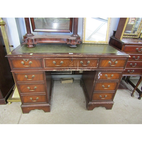 2110 - A reproduction mahogany twin pedestal desk, wear to top timber section