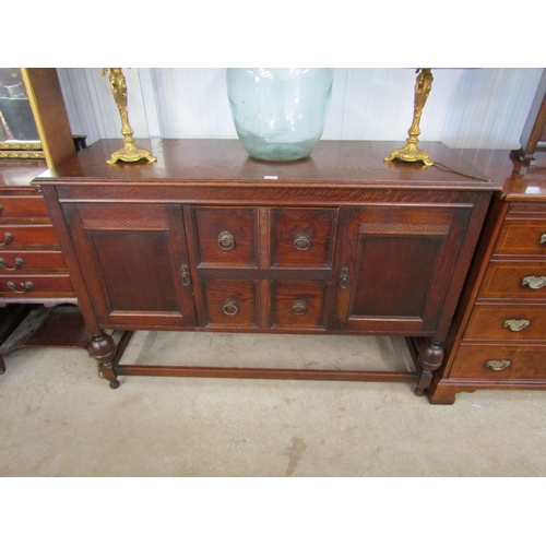 2117 - A 1940's oak two door, two drawer sideboard  (R)  £10