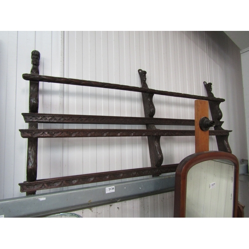 2136 - A Victorian heavily carved oak three tier plate rack with carved heads   (R)  £50