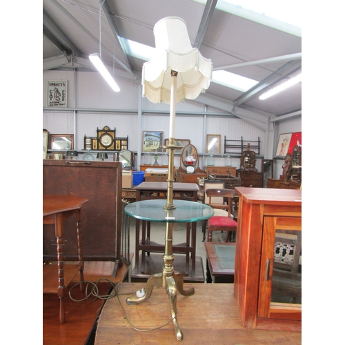 2206 - A brass tripod table lamp with glass centre tier