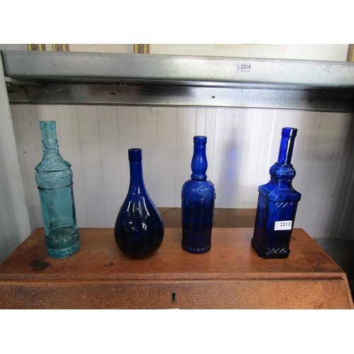 2213 - Four coloured glass bottles