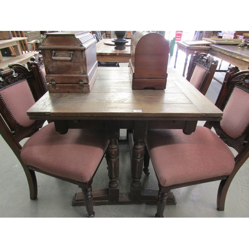 2221 - A 1940s oak draw leaf dining table