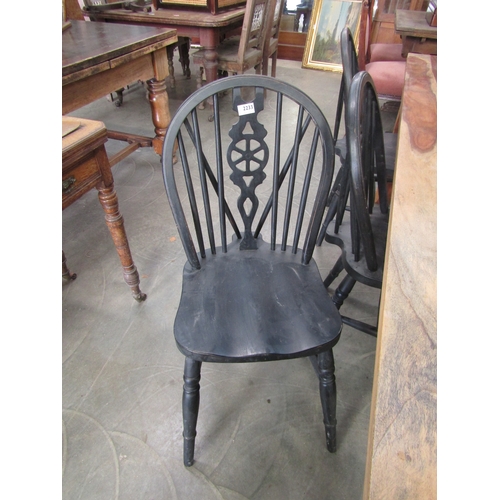 2233 - Six black painted wheel-back chairs