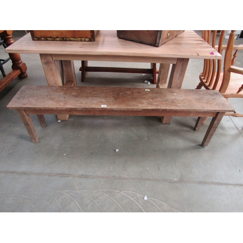 2237 - An oak bench raised on square legs 167cm long