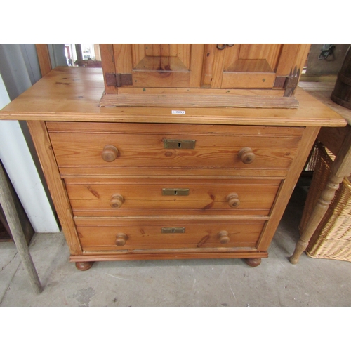 2251 - A Continental pine chest of three drawers