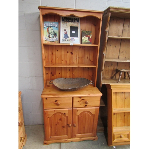 2274 - A pine dresser, two shelves over two drawers with twin cupboards