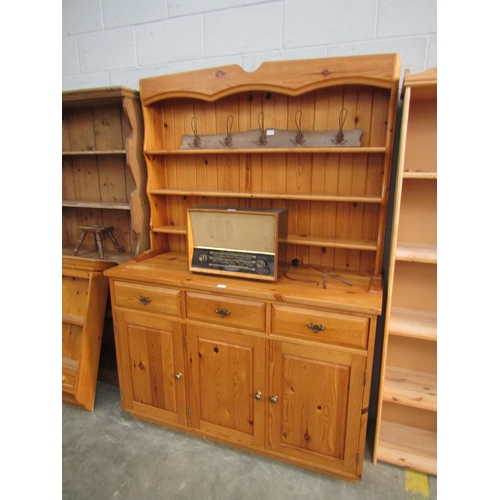 2281 - A pine double height dresser closed shelves to top over three drawer, three cupboard base