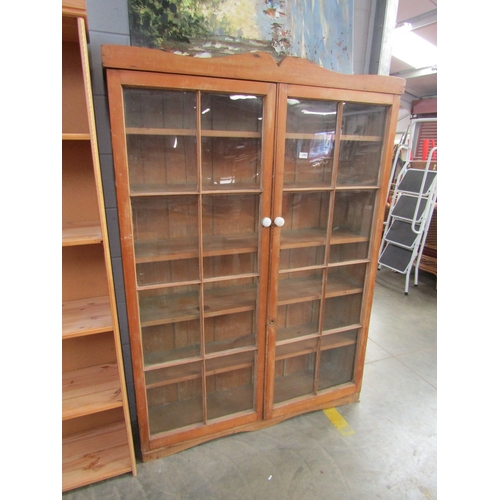 2283 - A 19th Century pine full height bookcase glazed double doors, five shelves, porcelain handles