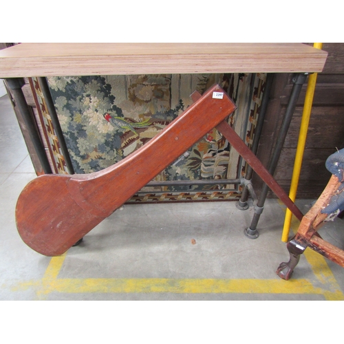 2297 - A mahogany boat rudder, paddles and anchor