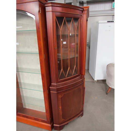 2305 - A reproduction corner unit, astral glazed single door base on bracket feet