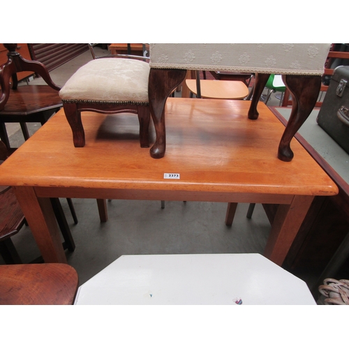 2373 - A small beech kitchen table on tapering legs