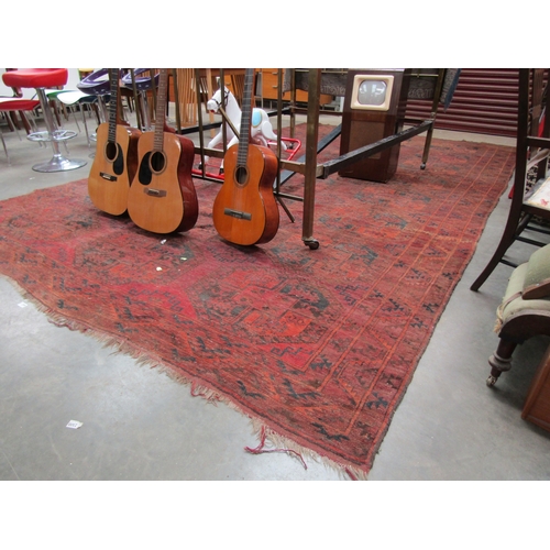 2389 - A worn red lounge rug, a/f 448 x 273cm