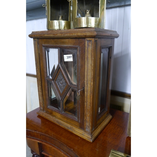 2097 - A late Victorian mahogany table cabinet with bevelled glass