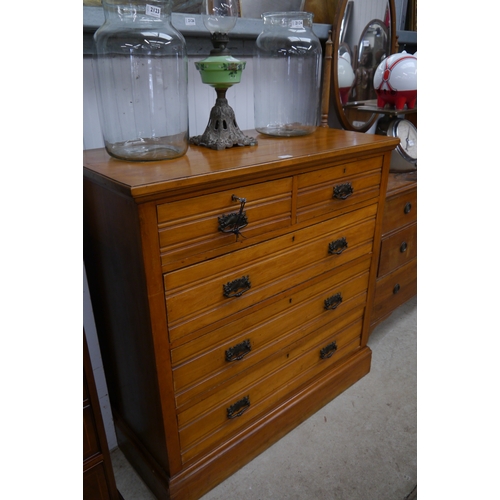 2122 - An Edwardian satinwood two over three long drawers, plinth base, key