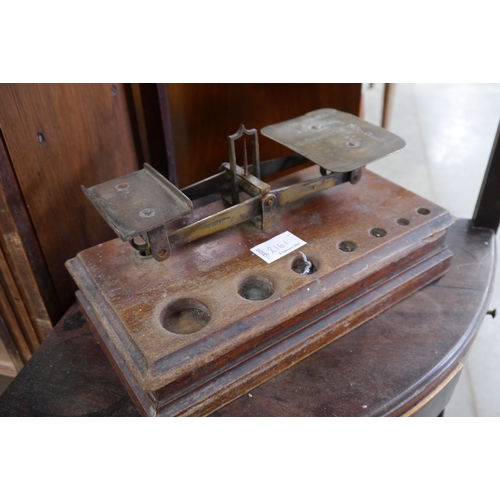 2161 - A brass letter rack desk stand and Victorian set of letter scales