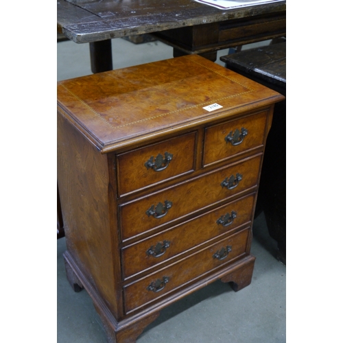 2185 - A small 20th Century chest of drawers, two over three drawers on bracket feet