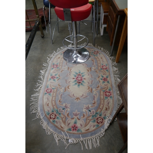 2379 - A pink and blue Chinese oval rug