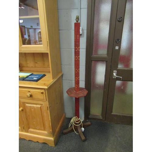 1039 - A red leather effect covered floor lamp with middle shelf and gilt detailing, 151cm high (worn)     ... 