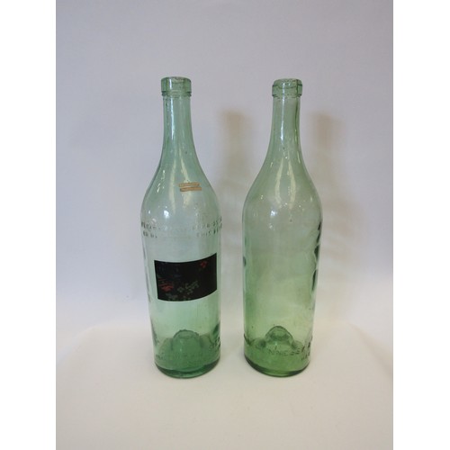 1061 - Two large French green glass bottles, one 