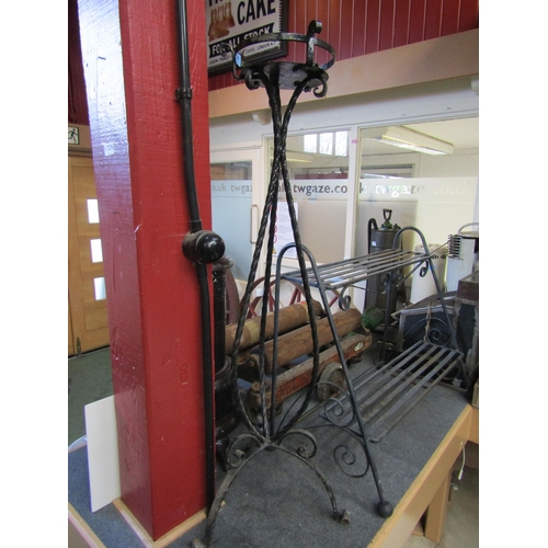 5005 - A wrought iron tripod base pot stand