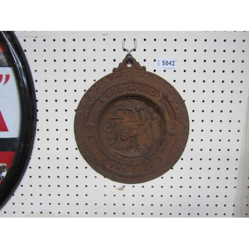 5042 - A circular cast iron plaque 