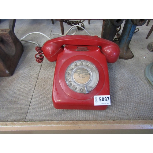 5087 - A red 746F dial telephone