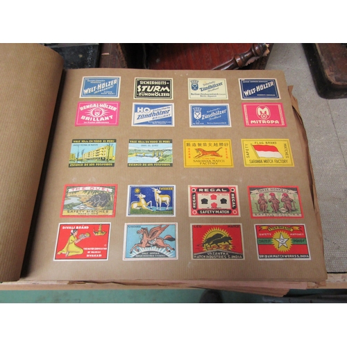 5127 - Three albums of match box covers to include early 20thc examples, Japanese, Russian and Continental ... 