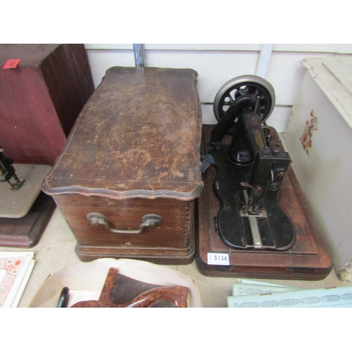 5136 - A wooden cased sewing machine