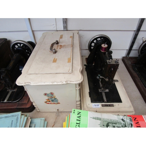 5137 - A wooden cased sewing machine, mother of pearl inlay