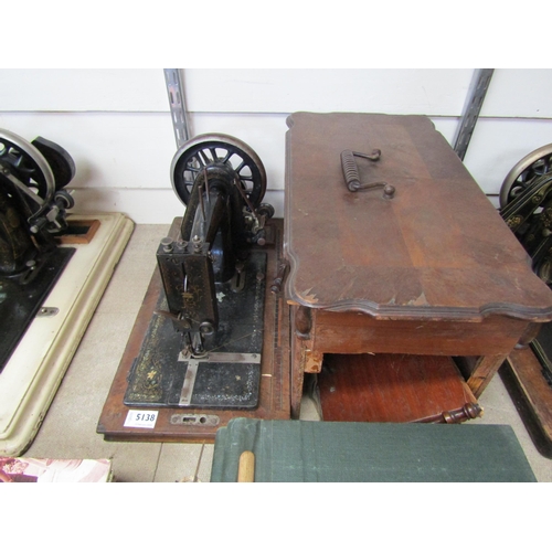 5138 - A wooden cased sewing machine