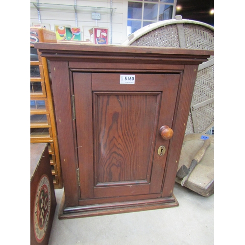 5160 - A pitch pine single door cupboard with 'Carters' card label to top and interior, 43cm x 27cm x 53cm ... 