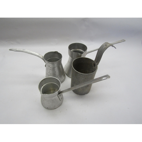 5279 - Four aluminium milk measures   (R)  £10