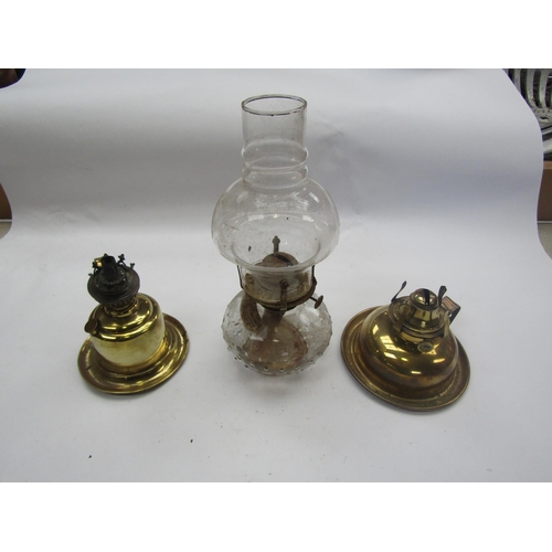 5284 - Two brass oil lamp bases and a glass oil lamp