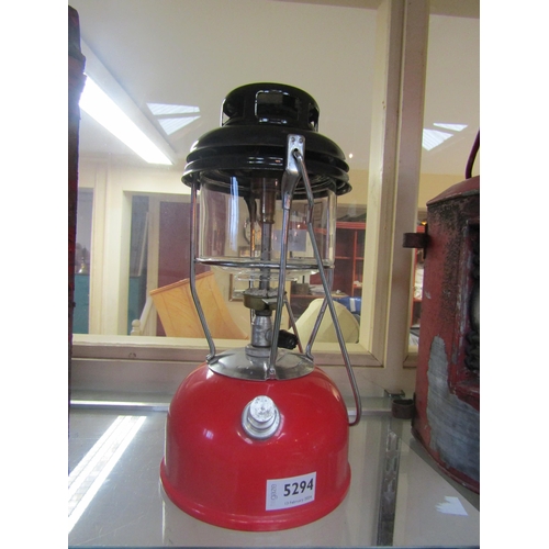 5294 - A red and black Tilley lamp