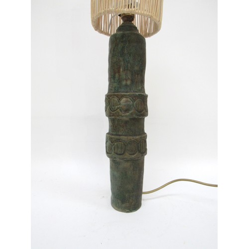 9029 - A studio pottery lamp base with green glaze. Indistinctly signed to base and dated 1966. 60cm high
