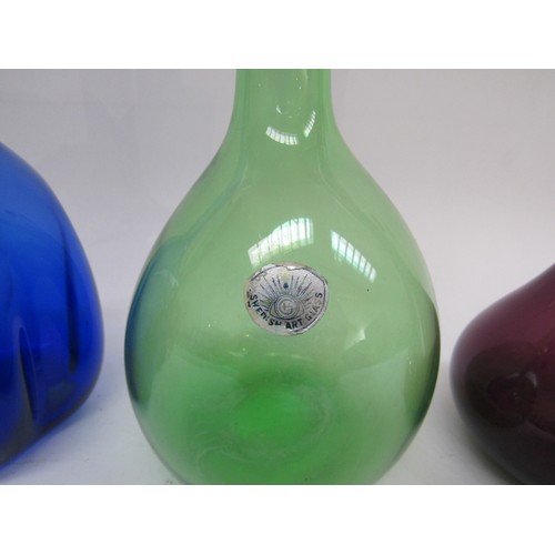 9185 - Four Arthur Percy Scandinavian glass vases in amethyst, blue and green. Tallest 30cm