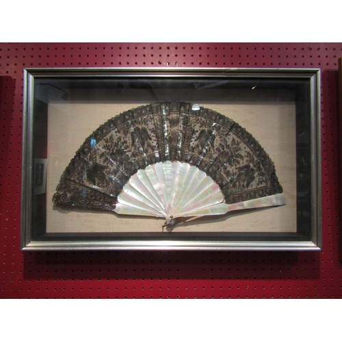 4042 - A Chantilly lace and mother-of-pearl fan, framed and glazed, frame 37cm x 60cm