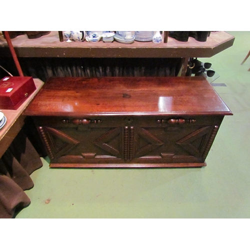 4182 - An 18th Century and later oak two panel coffer the hinged lid and moulded front over stile feet, 52c... 